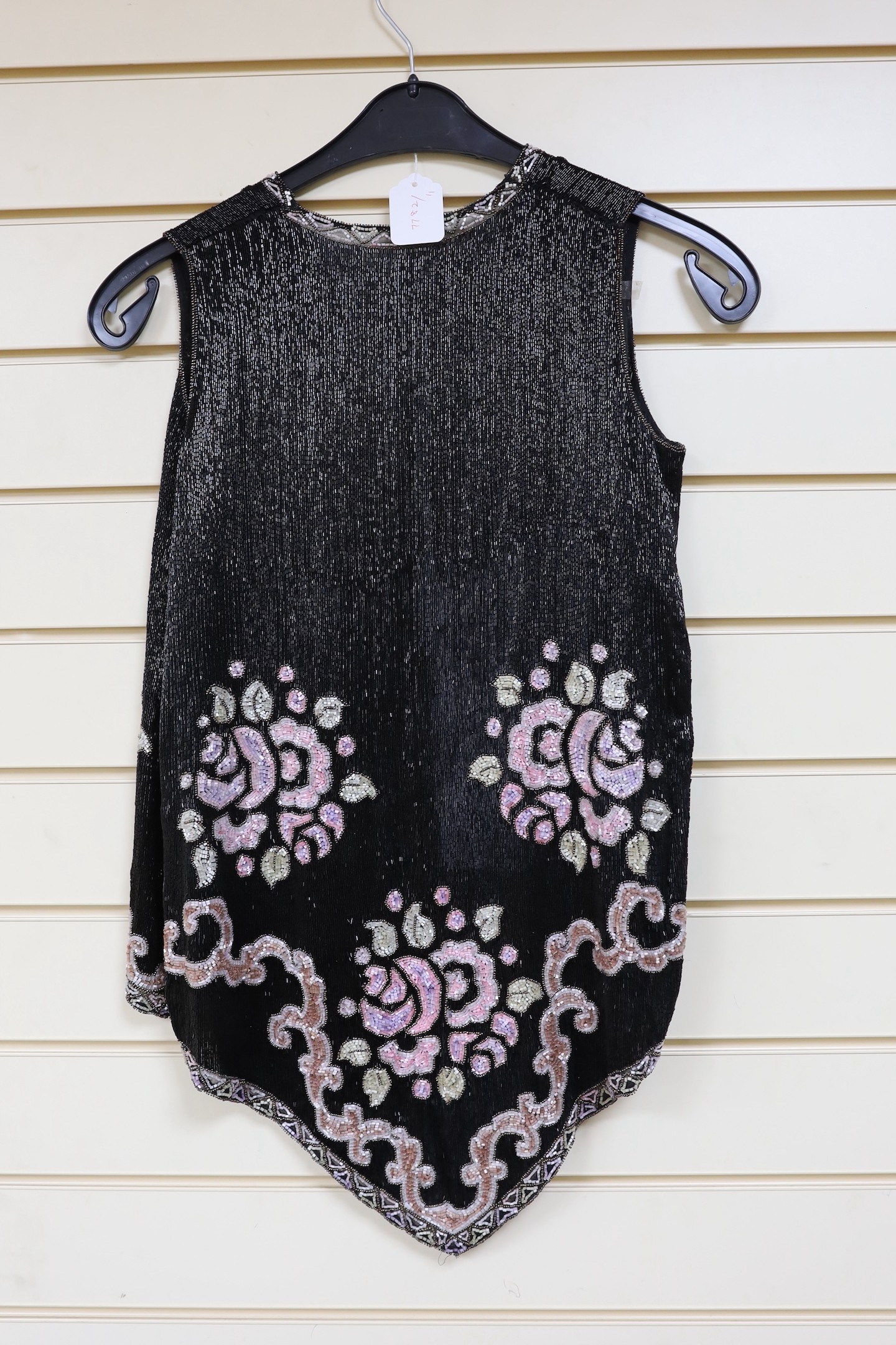 A 1920's multi-coloured beadwork sleeveless evening jacket